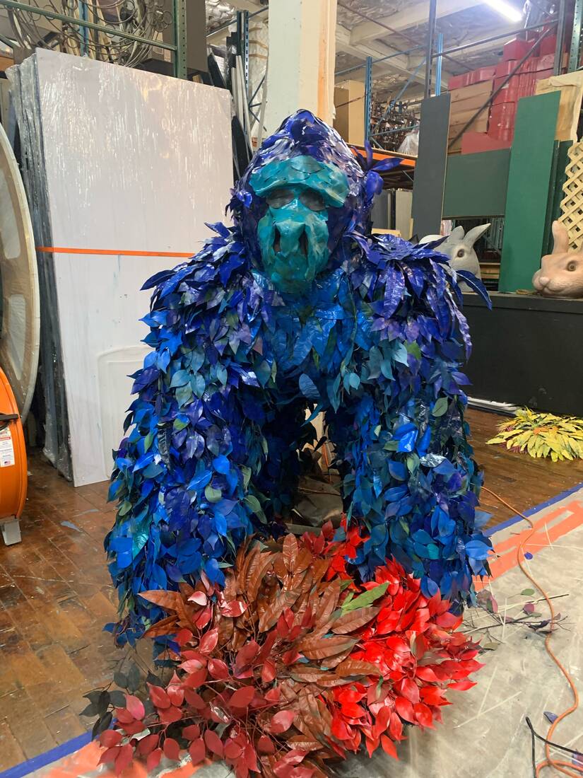 Gorilla sculpture built from preserved leaves in deep blues